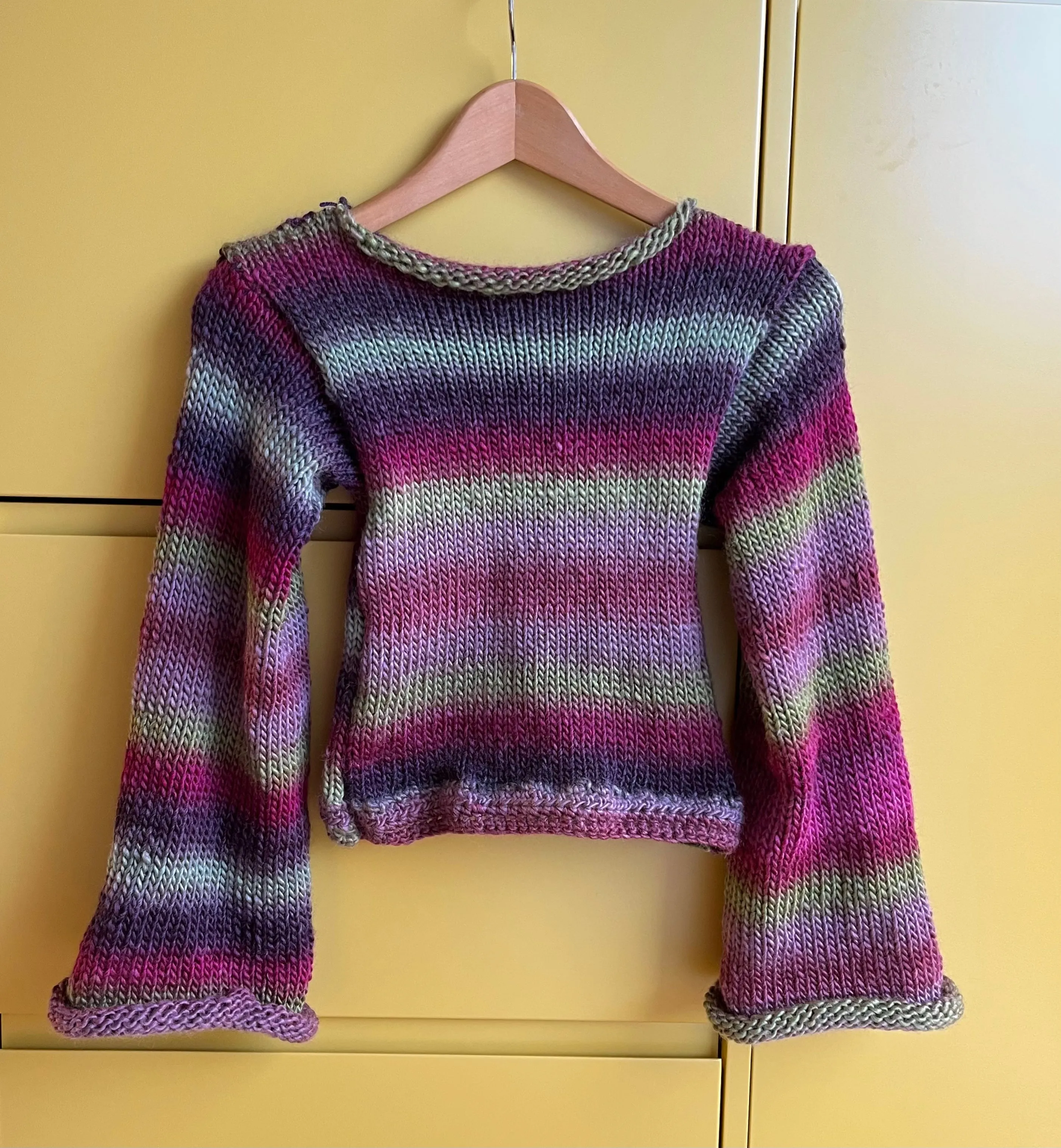 Handmade ombré knitted flared sleeve jumper in green and purple shades