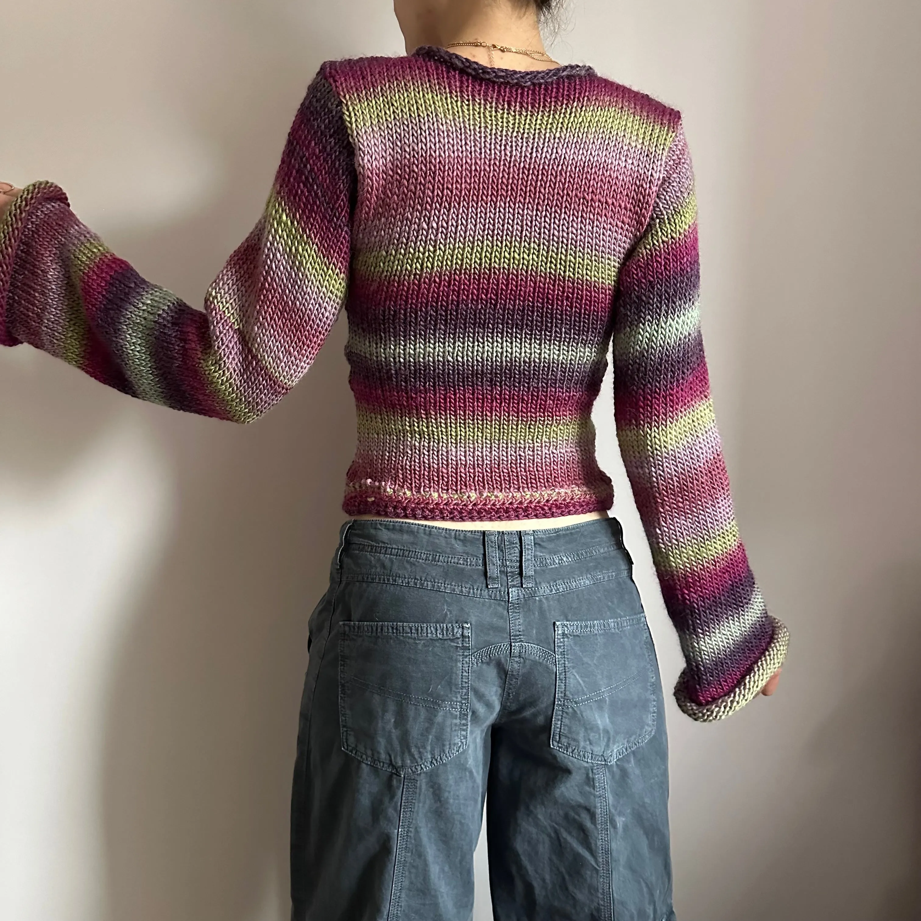 Handmade ombré knitted flared sleeve jumper in green and purple shades