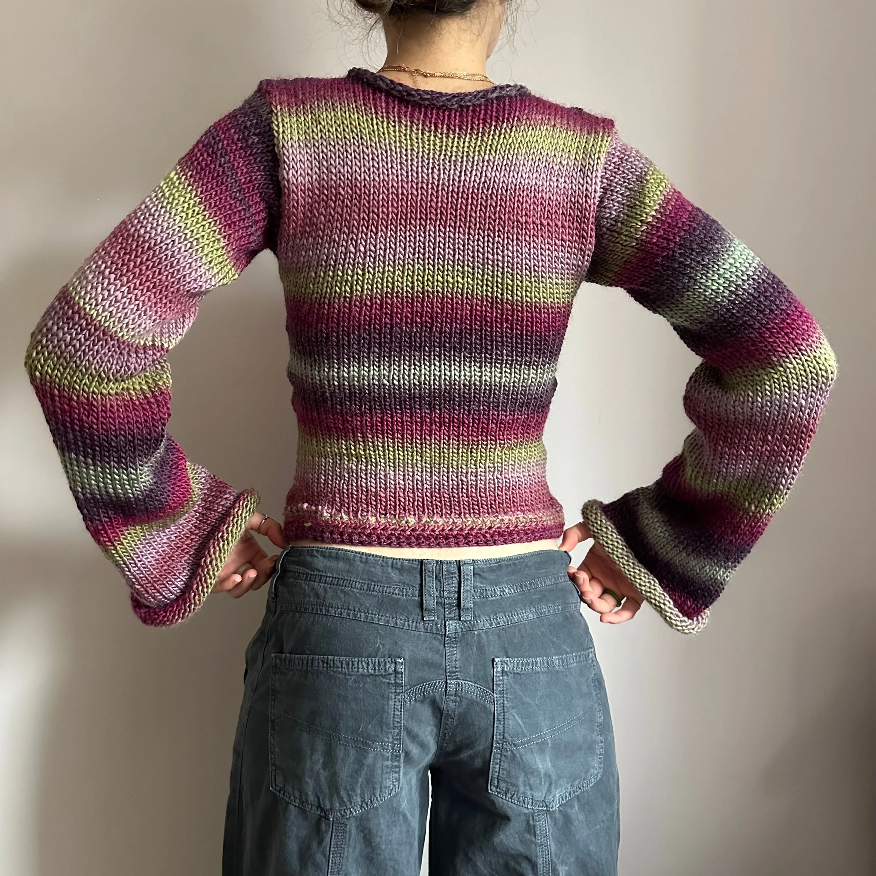 Handmade ombré knitted flared sleeve jumper in green and purple shades