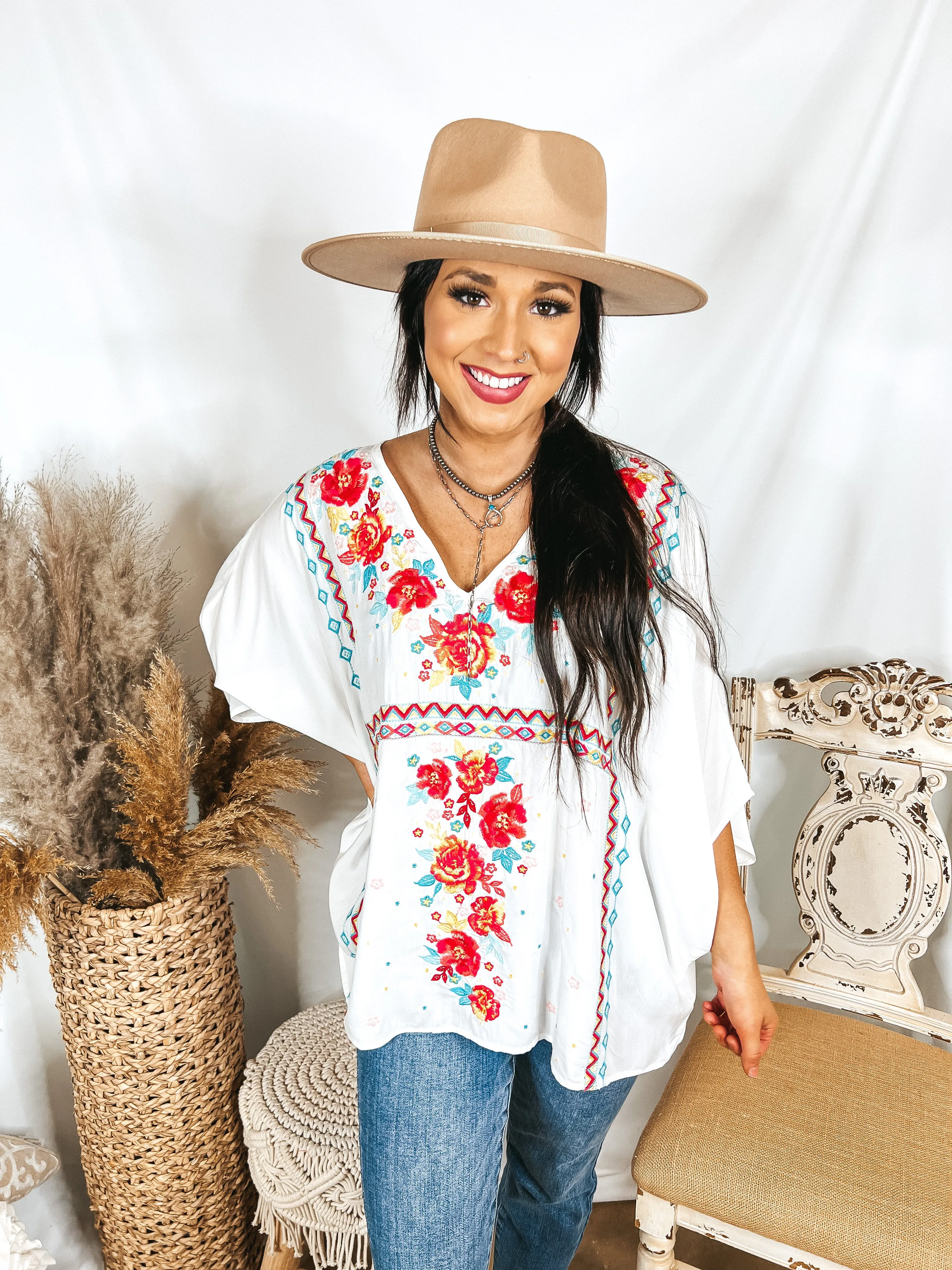 More To The Story Floral Embroidered Poncho Top in White